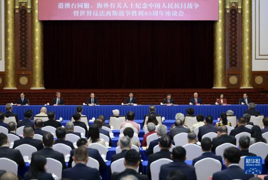 王沪宁会见伊朗总统佩泽希齐扬